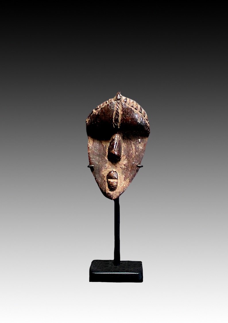 Bassa mask, Ivory Coast, Liberia, offerings rubbed on the mask to increase it's power.  www.gallerytribalart.com
