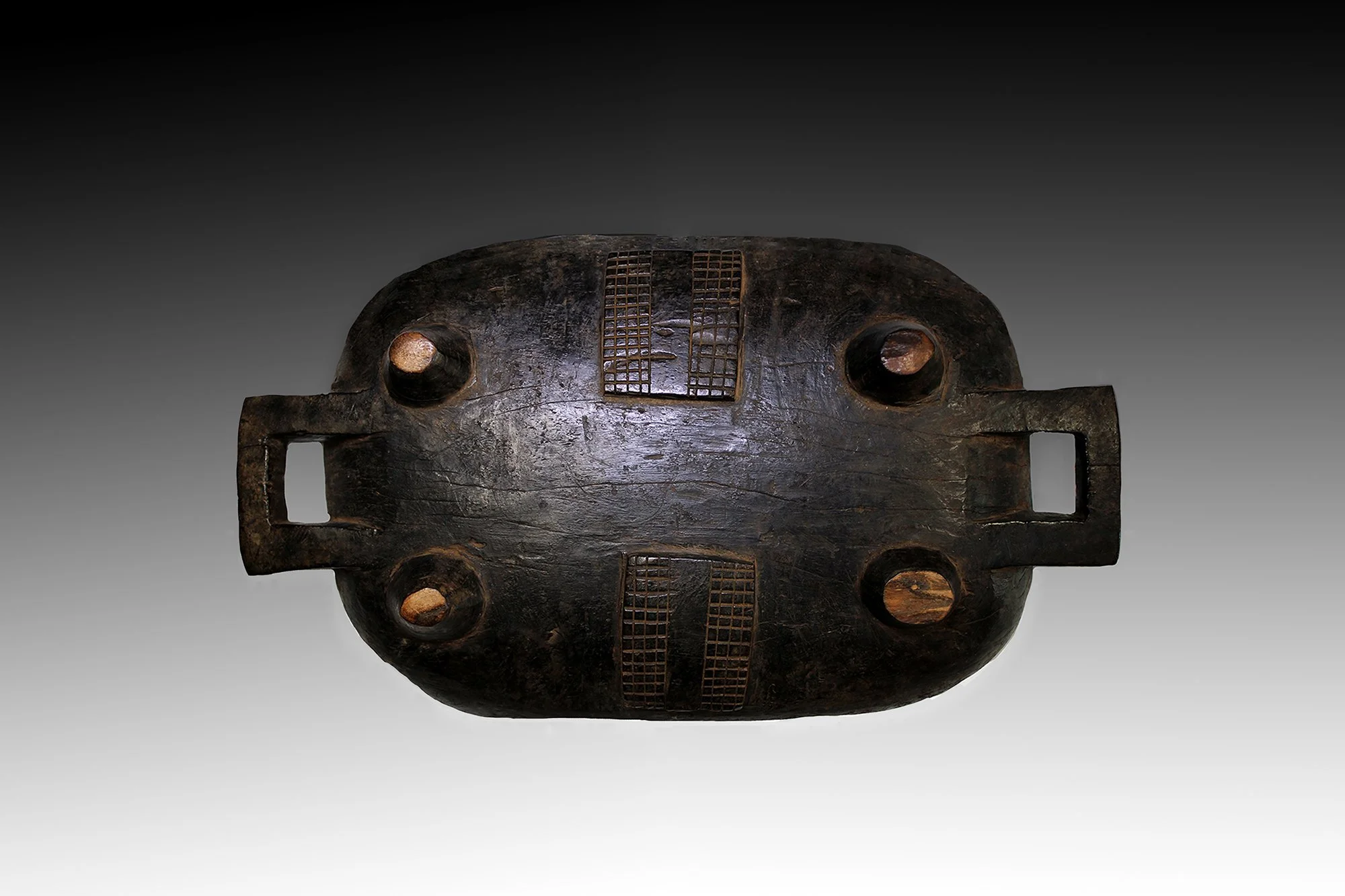 Zuly meat platter's underside is decorated with designs and is charred black.  www.gallerytribalart.com