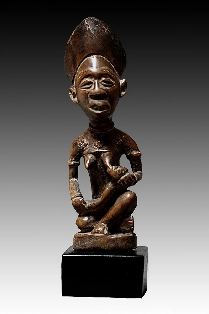 Yombe mother and child figure called Phemba, represents the mythical mother and child honoring the maternal spirit used in fertility.  www.gallerytribalart.com