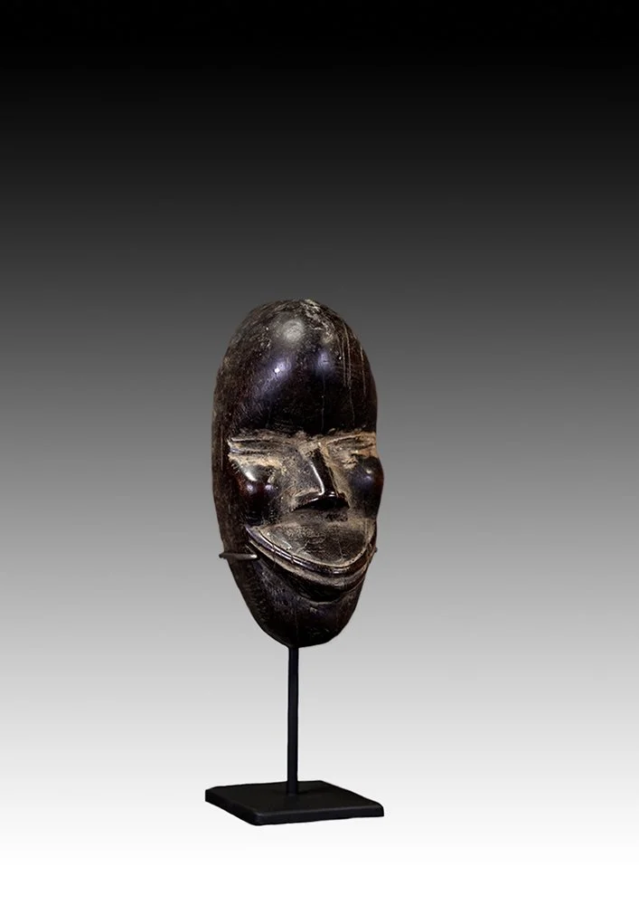 Dan mask kept by individual familes for protection.  www.gallerytribalart.com