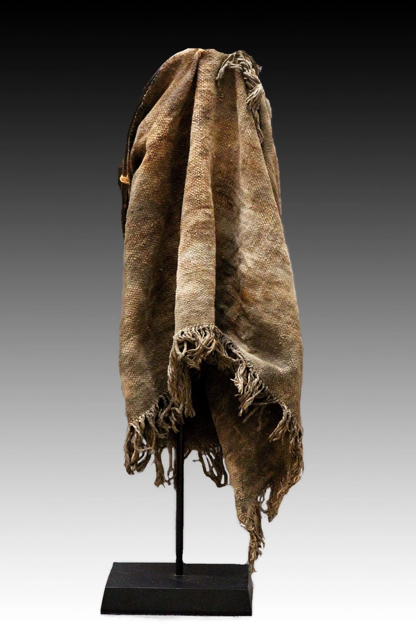 Igbo mask, back view showing fiber costume.  www.gallerytribalart.com