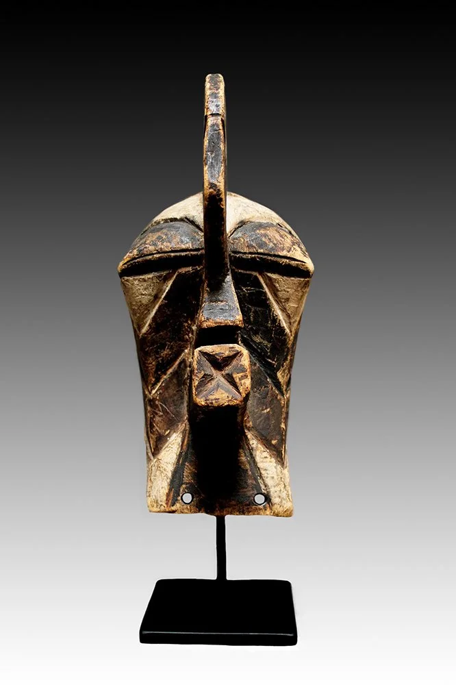 Songye Kifwebe mask has jutting mouth.  www.gallerytribalart.com