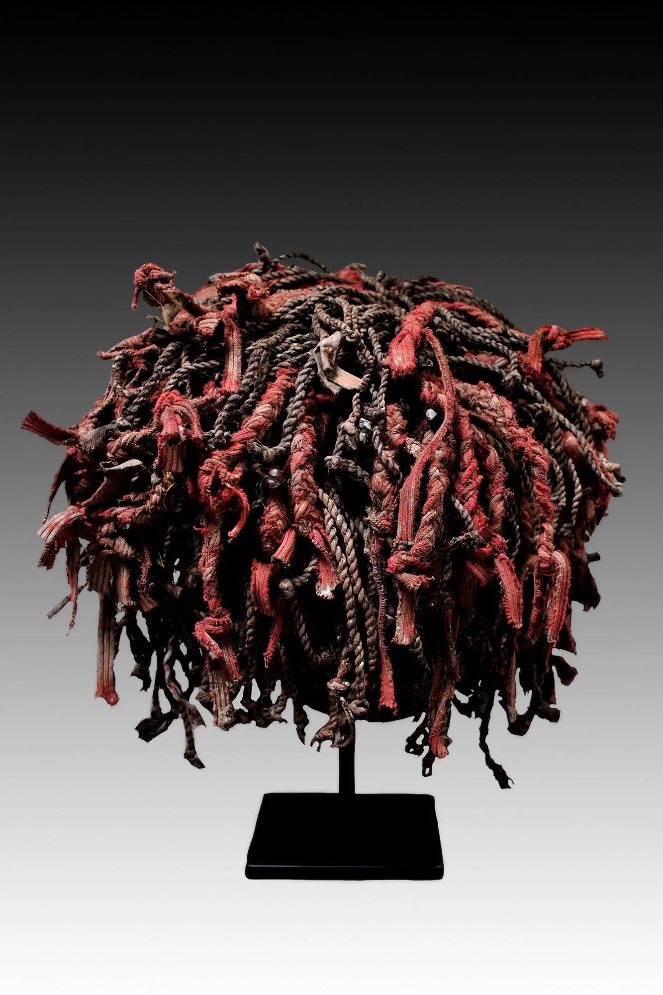 Chokwe mask, back view, with large braided fiber hairstyle.  www.gallerytribalart.com