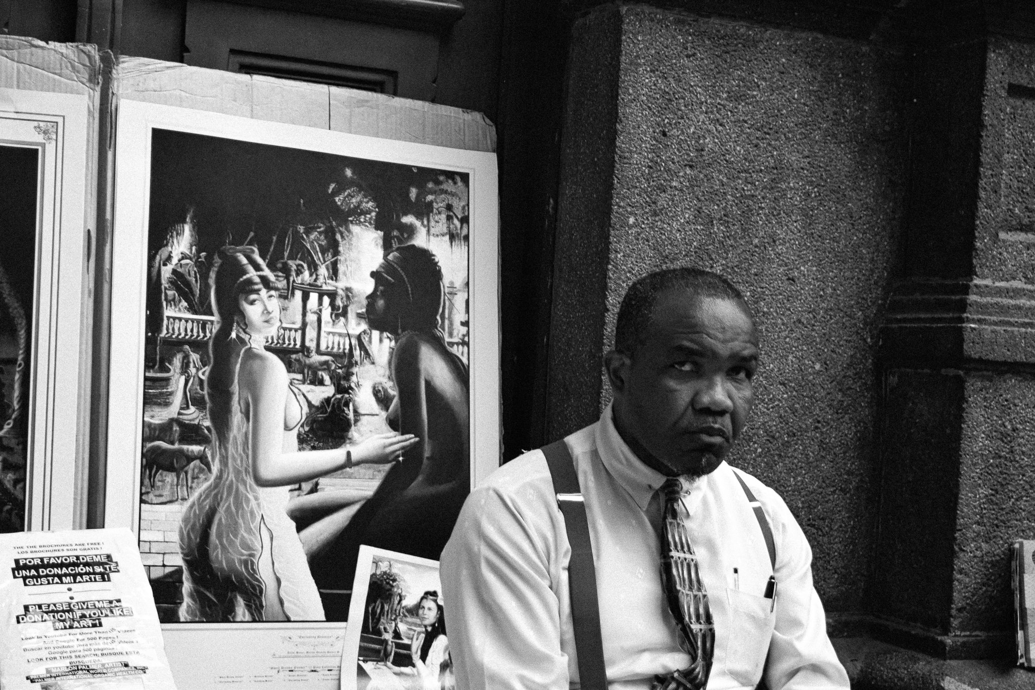 A street vendor selling his art in one of SJ main avenues.