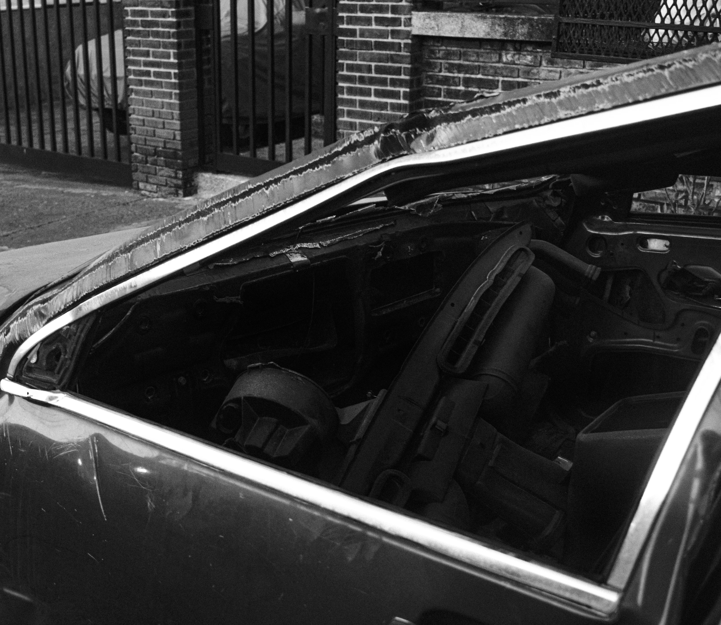 The rests of an old car found as a junk in the suburbs.