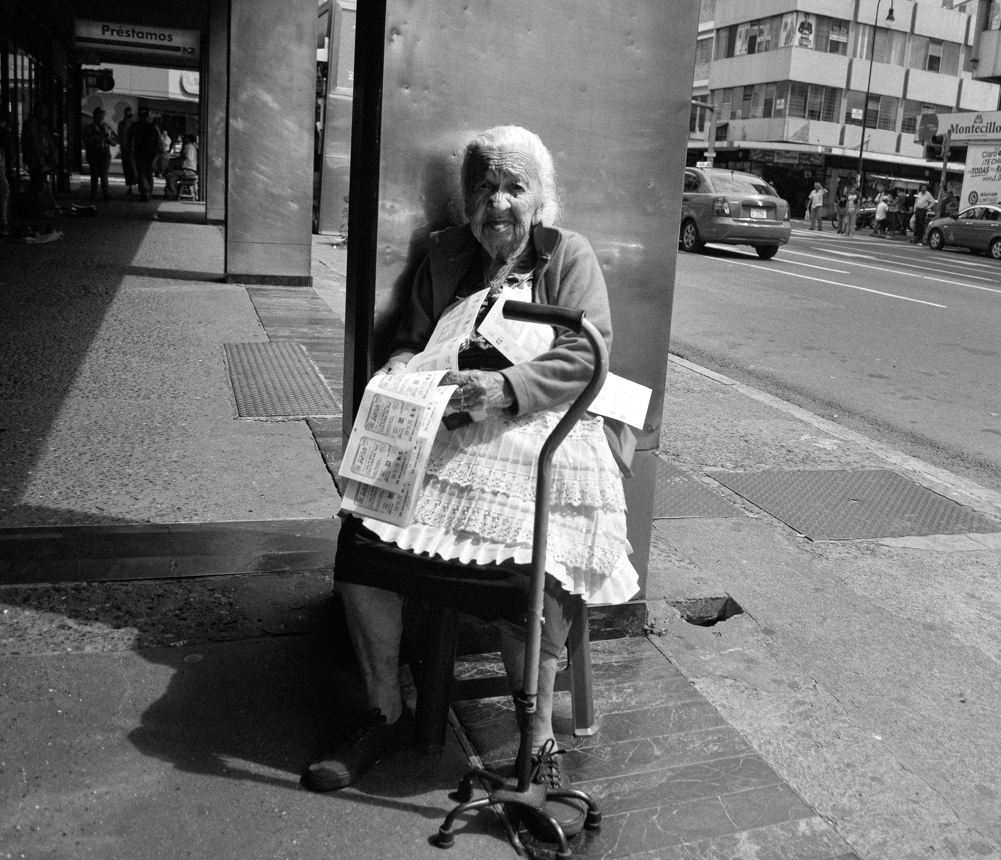 An eleder woman selling lottery tickets in the Segunda Avenida. (Second Ave.) one of SJ's busiests streets.