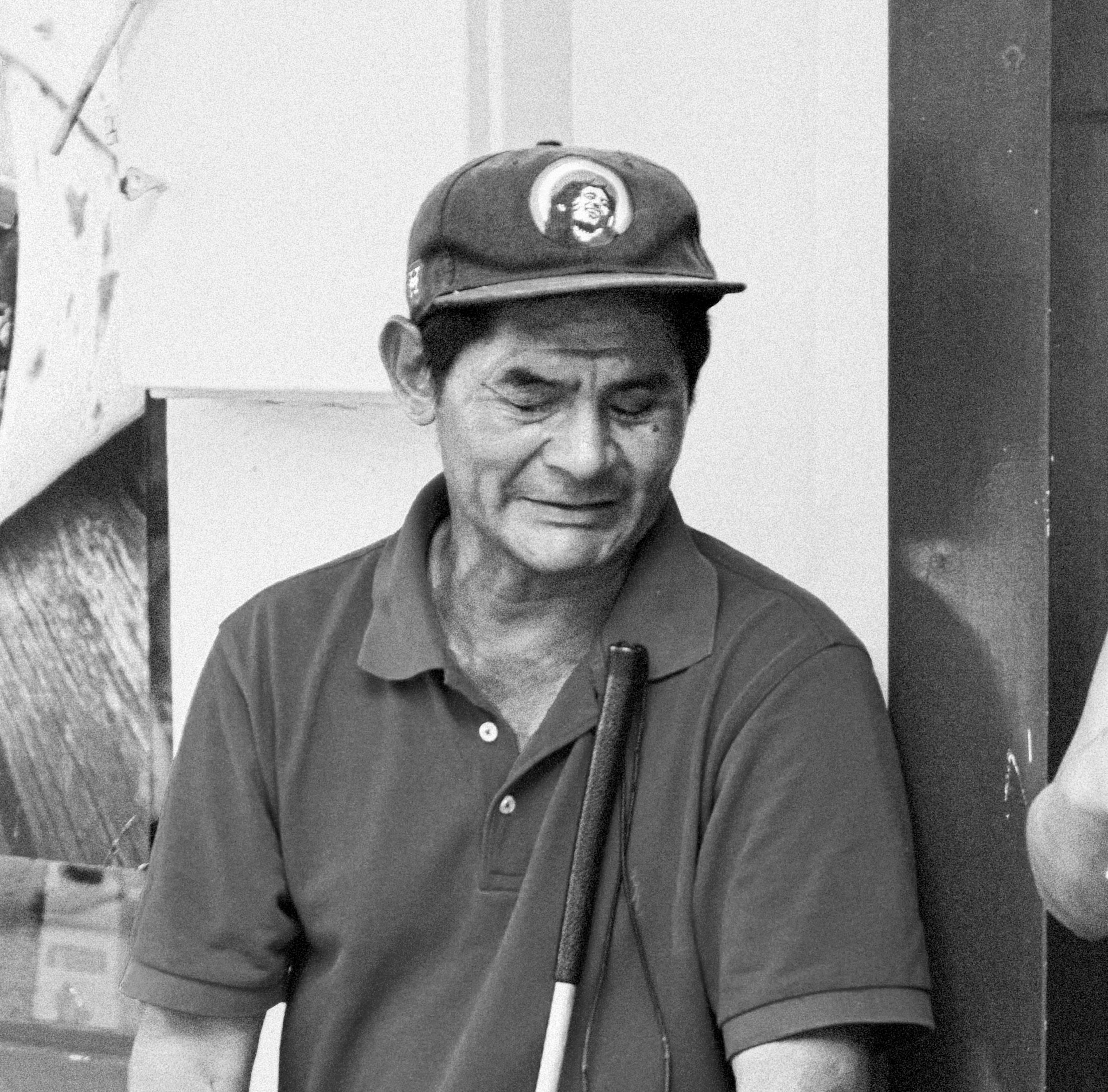 A blind man taking a rest.