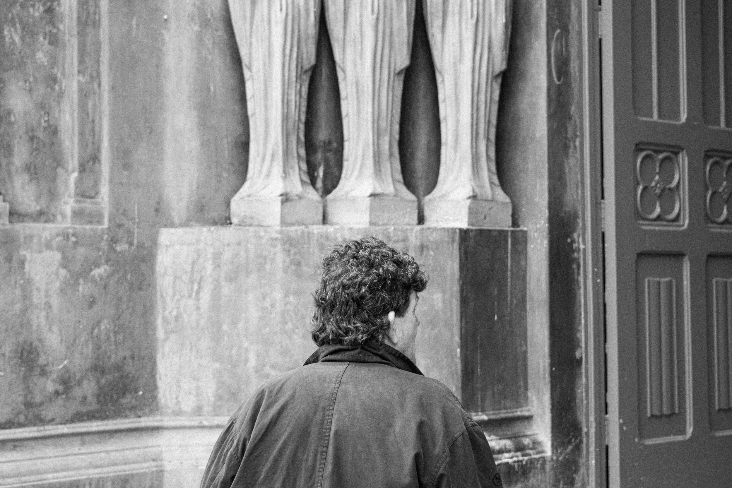 A man entering the church of Our Lady of Solitude in downtown SJ.
