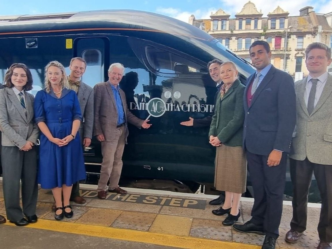 The cast at a televised train naming ceremony