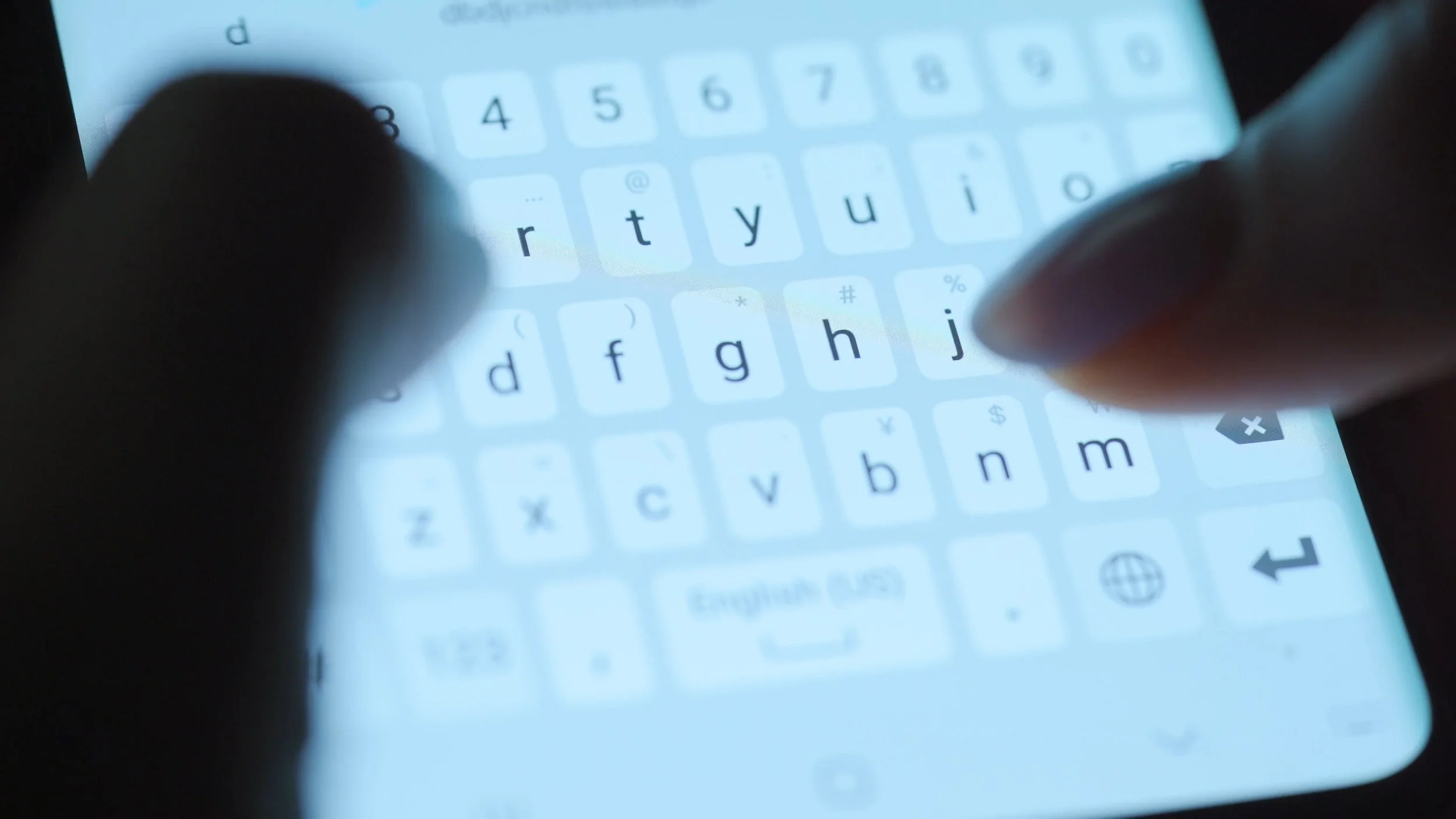 hands-typing-text-on-smartphone-close-up-using-smartphone-close-up-at-night-SBV-337999874-4K+copy.jpg