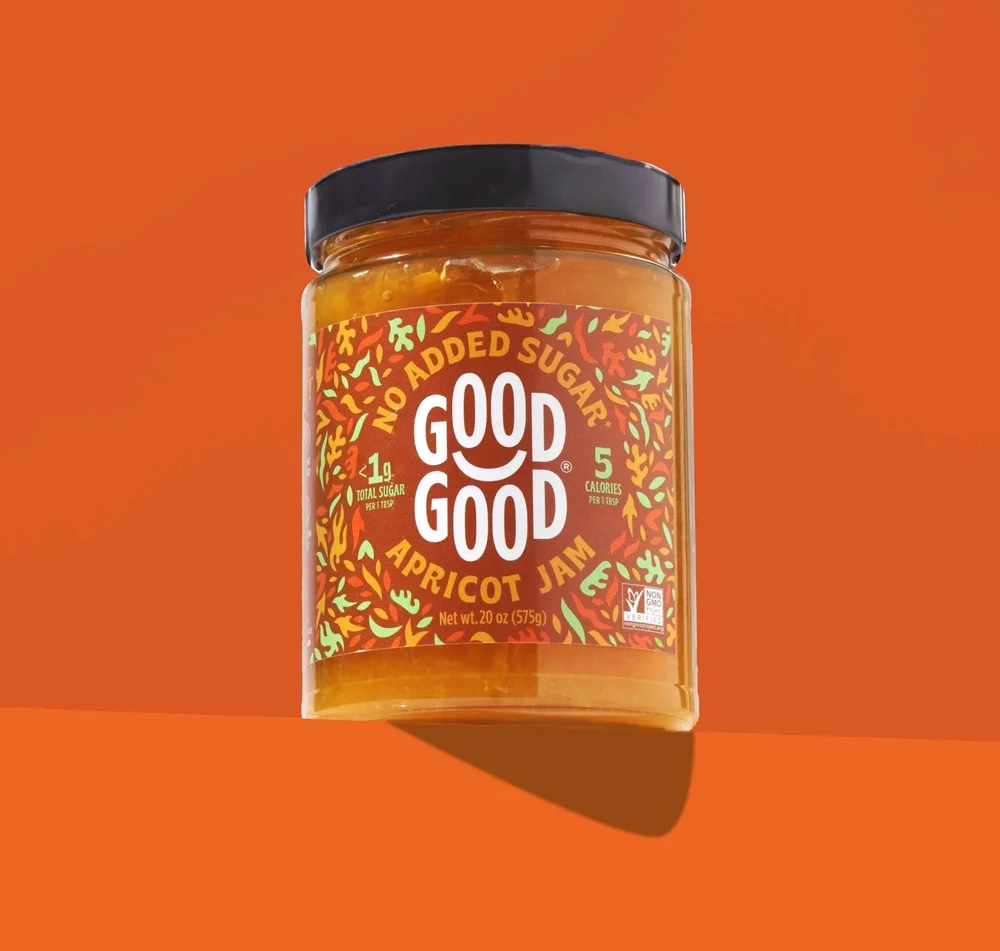 Good Good no sugar added apricot jam jar hero shot on orange, CPG product photography