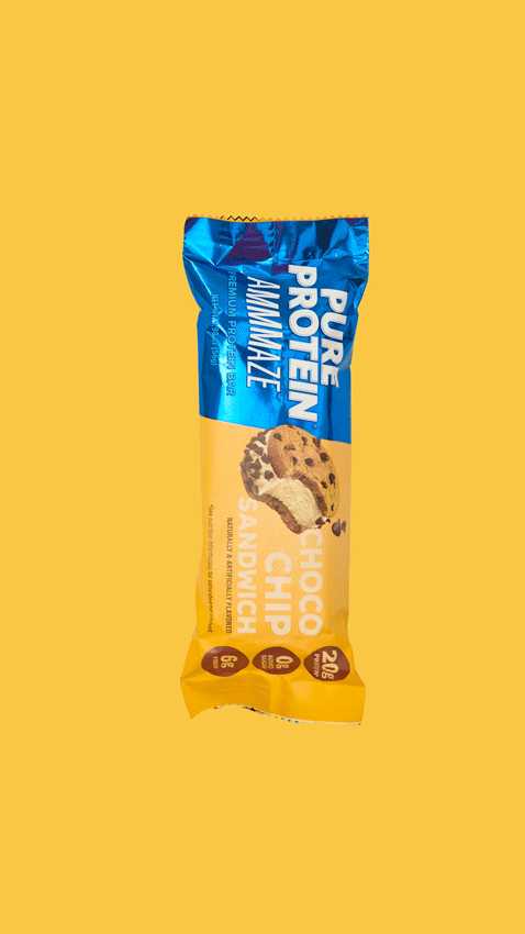A pack of Pure Protein Almighty snack with chocolate chip cookie flavor on a yellow background.
