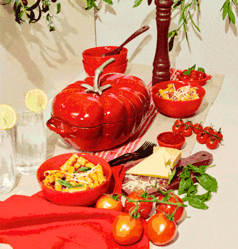 Stop motion GIF of pasta cooking in a tomato-shaped pot. Animated cookware and recipe content.