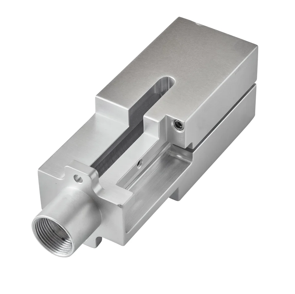 Machined aluminum block part on white, industrial parts photography