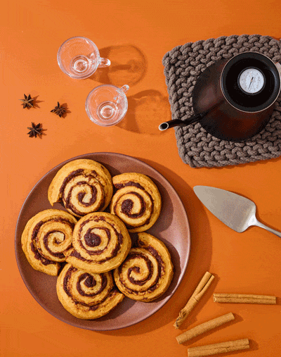 Cinnamon rolls served on an orange table stop motion GIF, bakery food video