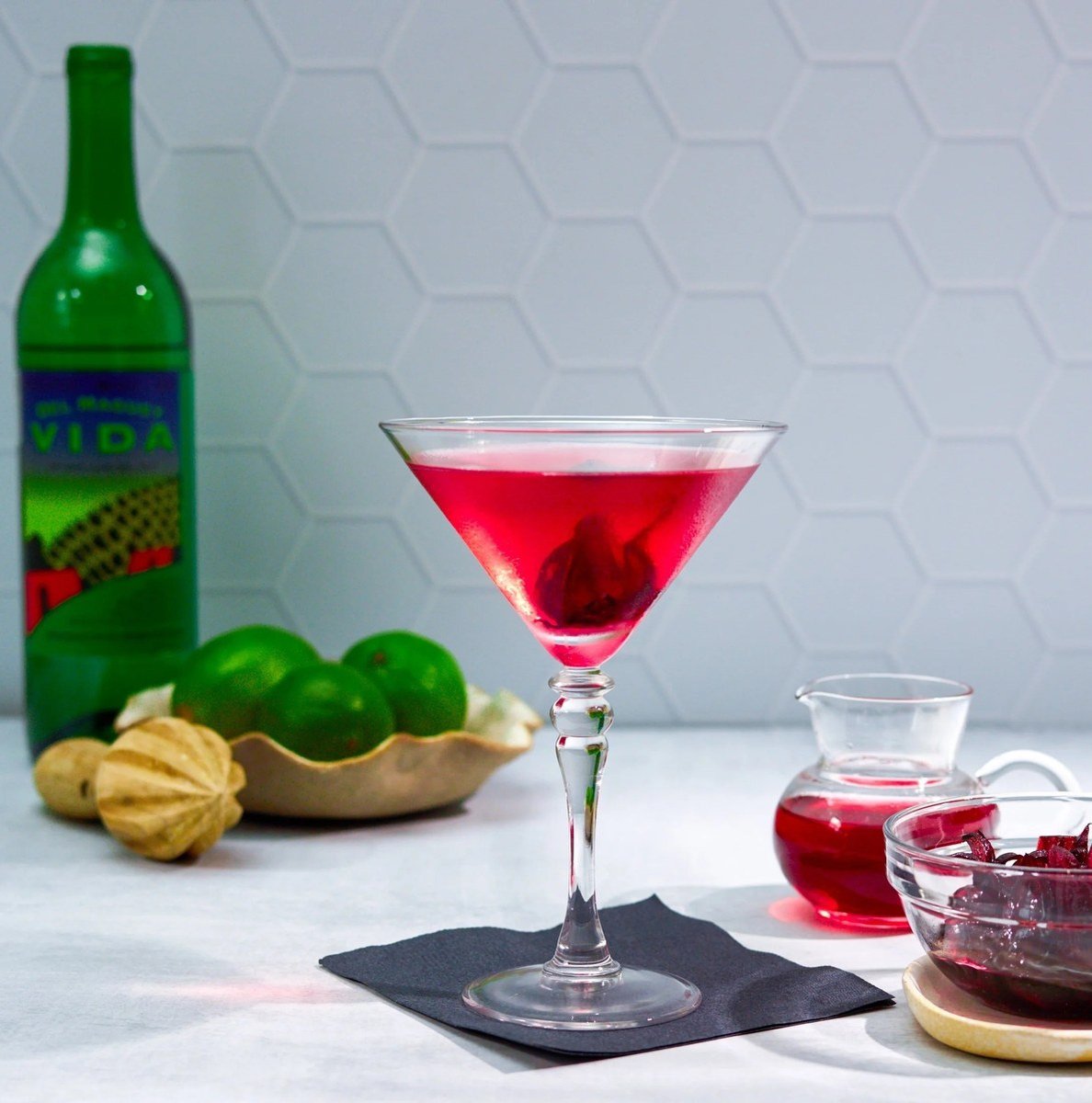Cosmopolitan-style cocktail with limes