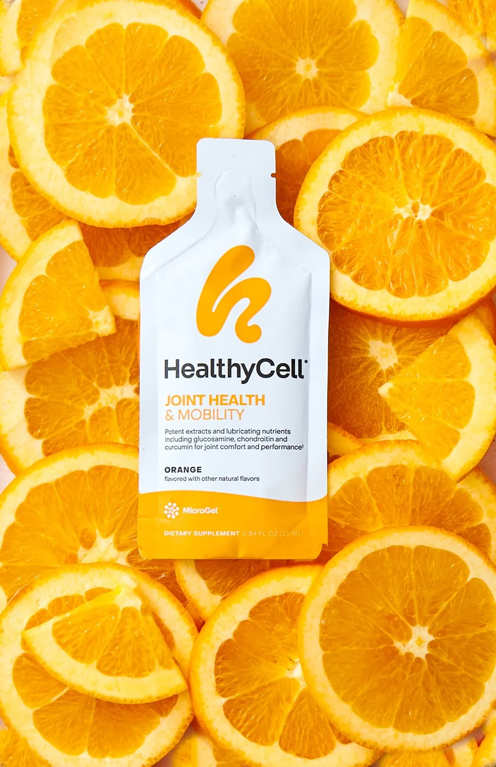 Healthy Cell packet on orange slices, supplement photography