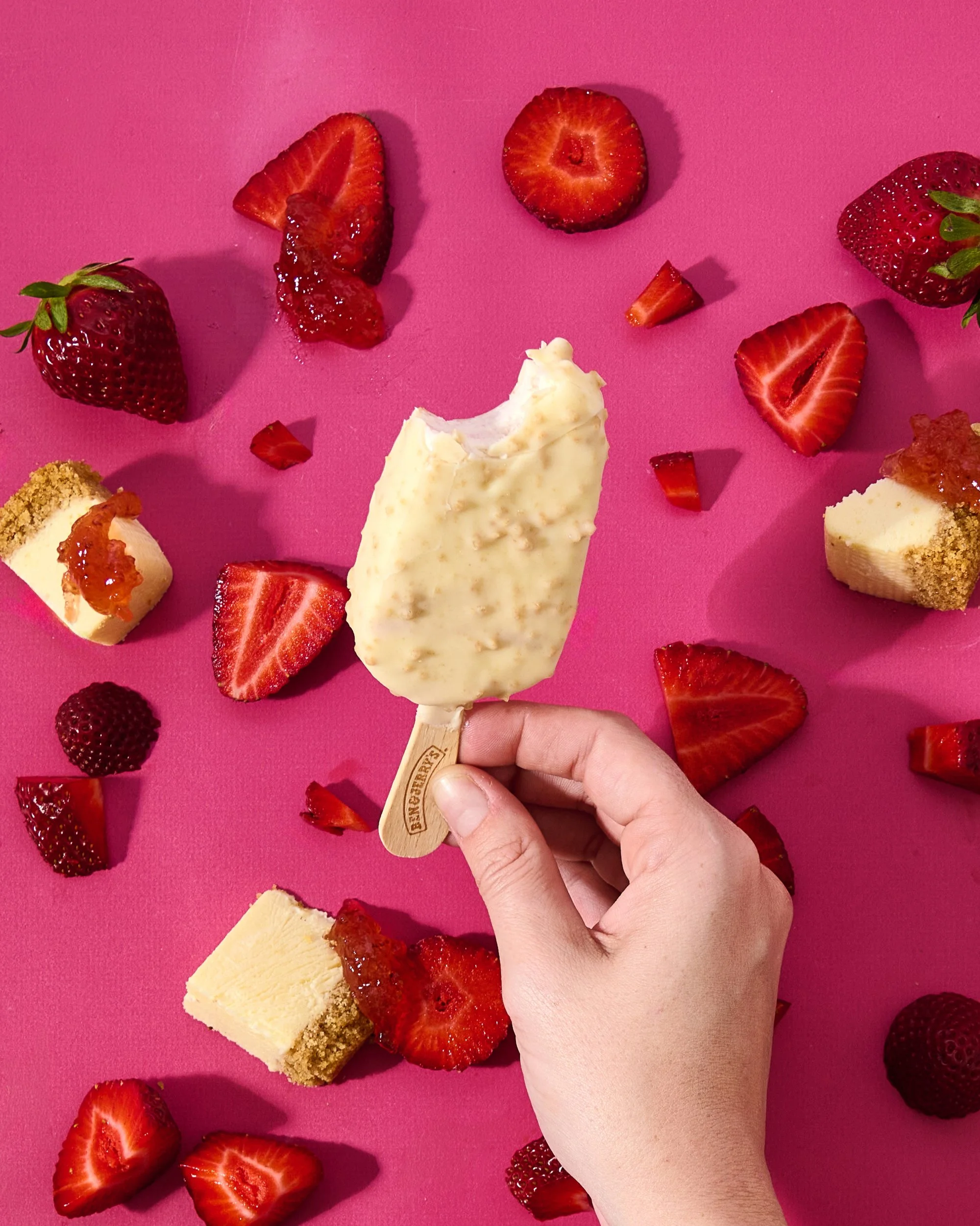 popsicle with flavor cues bright colors and hard shadows with a bite delicious engaging relatable food photography for brands