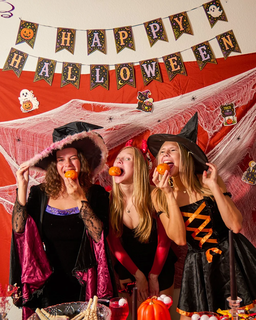 Witches in costume on a Halloween party set