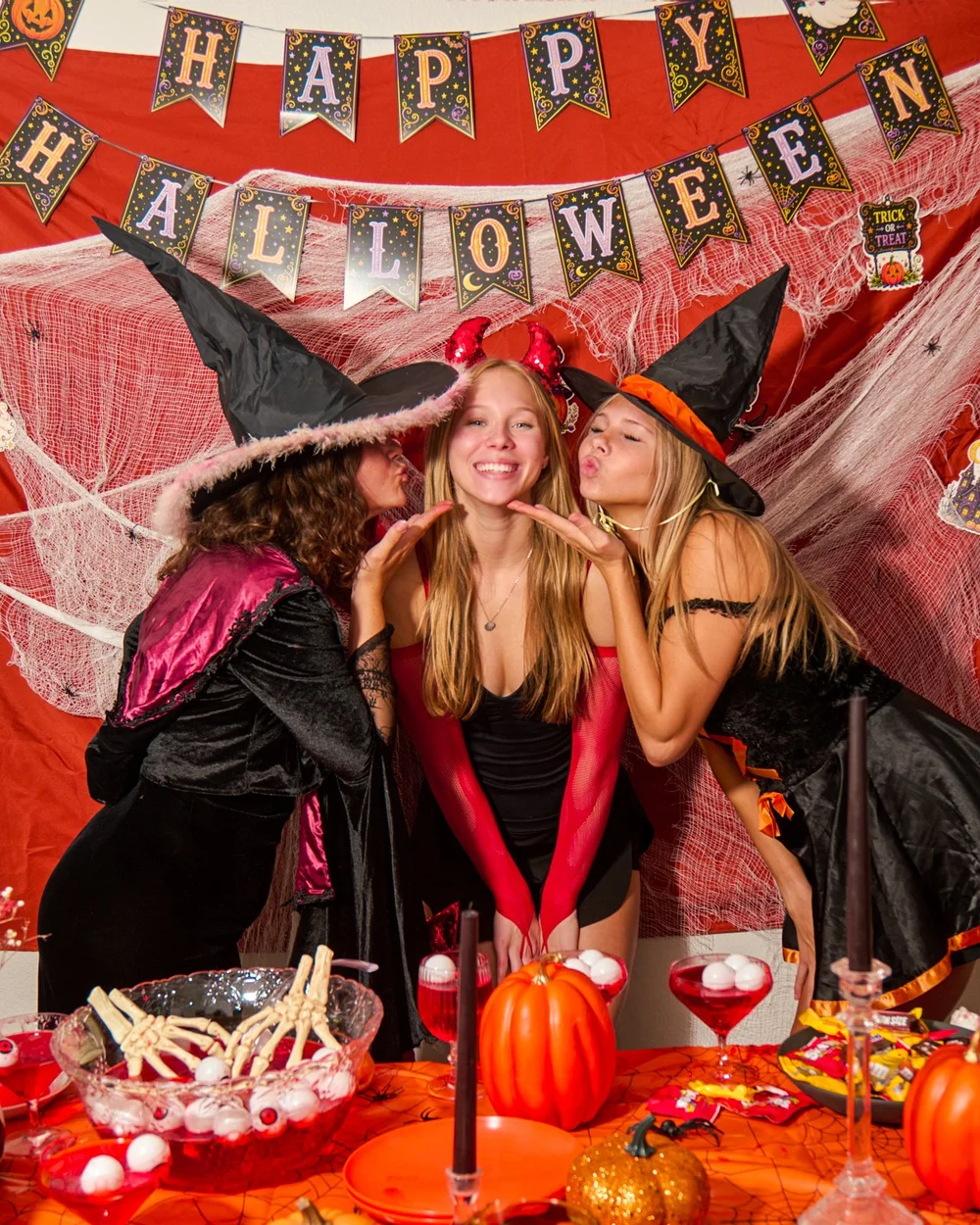 Halloween party set with witches and a pumpkin table