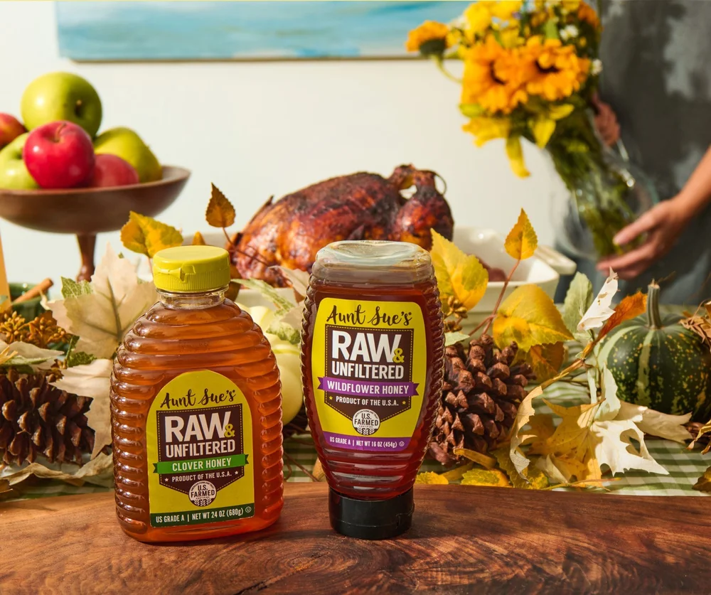 Thanksgiving table with honey and pinecones