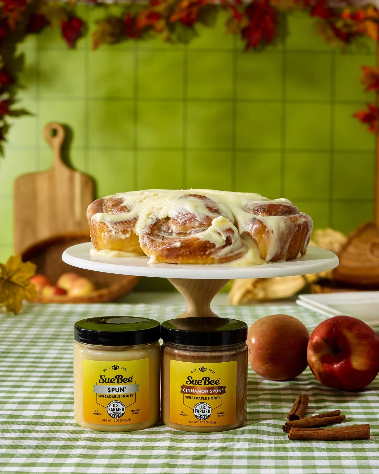 Fall baking set with green tile wall and cinnamon rolls