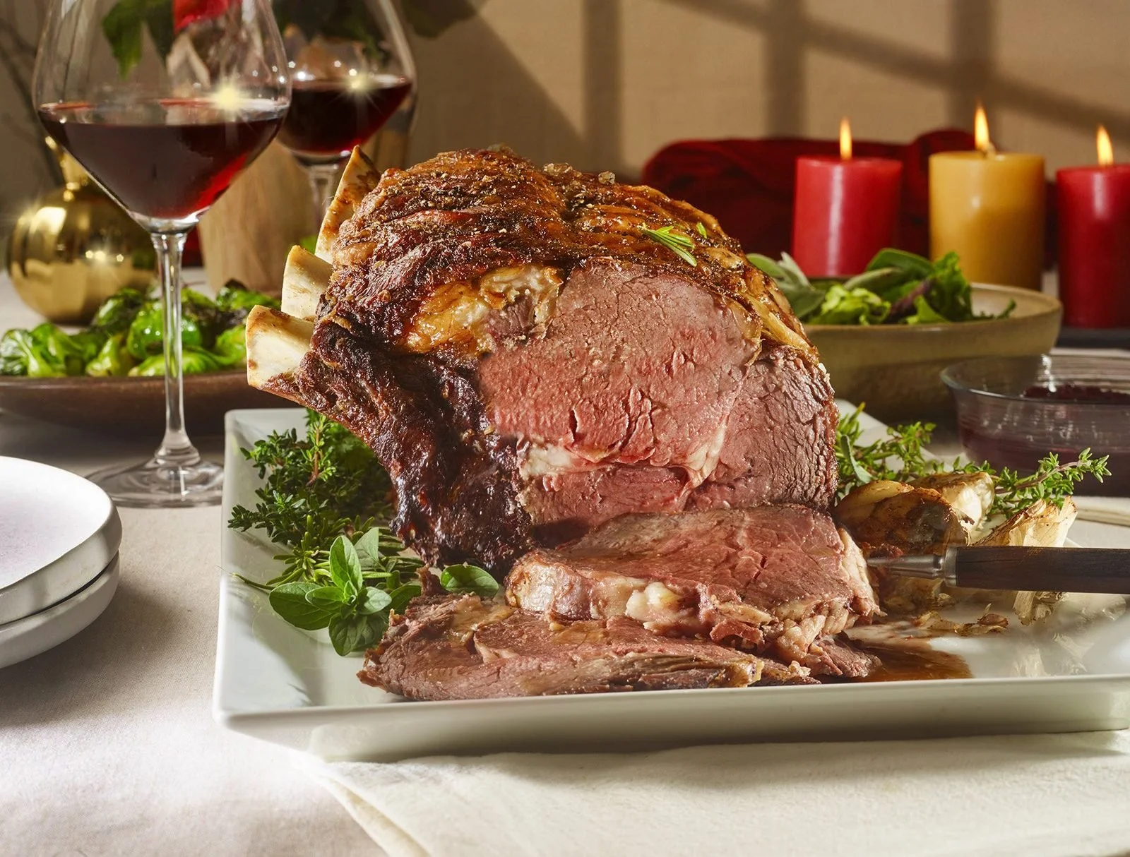 Food styling: holiday prime rib roast beef carved on a platter