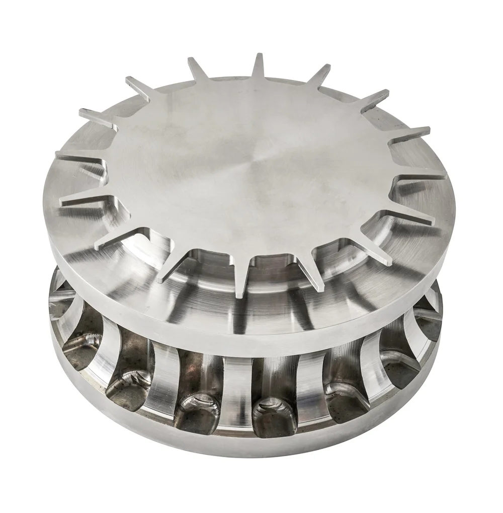 Machined aluminum heat sink part on white, industrial parts photography