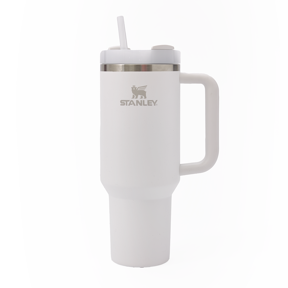 A white Stanley travel mug with a handle, silver rim, and straw on a white background.
