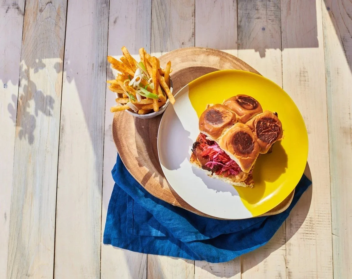 Brunch sandwich with fries on a yellow plate