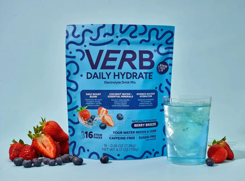Verb Daily Hydrate pouch with a berry drink and fruit, supplement photography