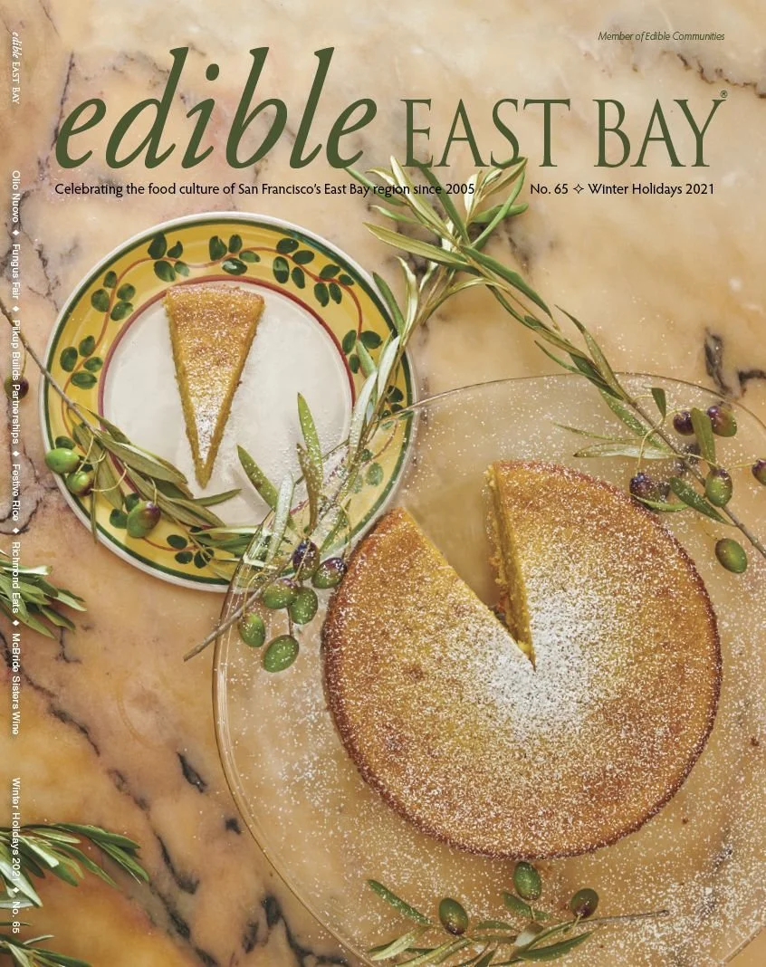 Edible East Bay magazine cover with lemon olive oil cake and olive branches, editorial food photography by Judy Doherty