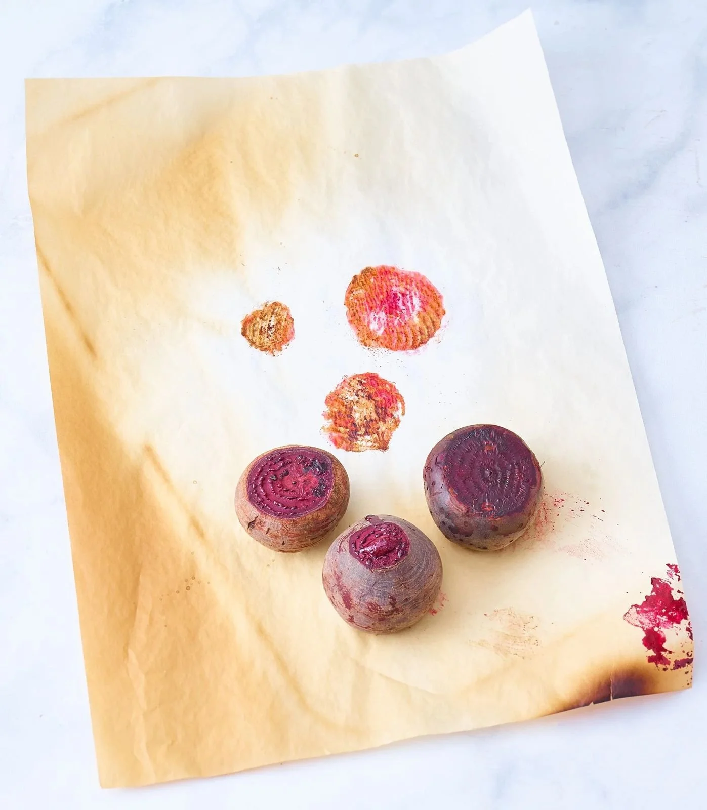 Beets and beet prints on roasting paper, artful food photography