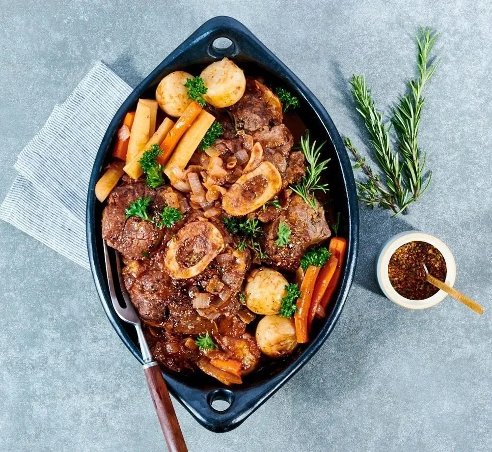 Food styling: osso buco braised with carrots and herbs