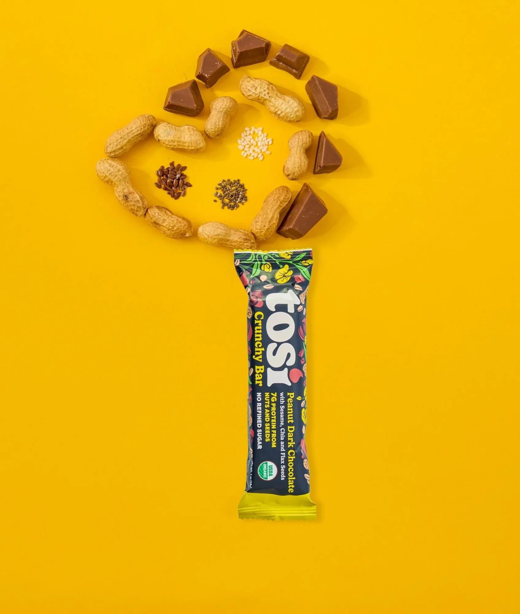Tosi bar with nuts on yellow, CPG snack photography