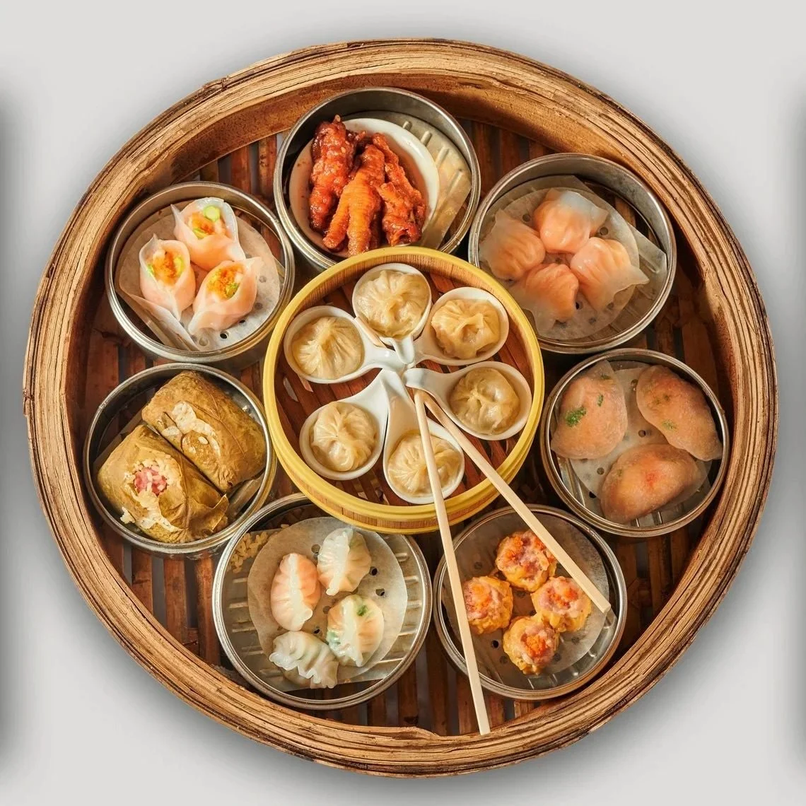 Overhead view of dim sum dumplings in a bamboo steamer. Restaurant and frozen food photography.