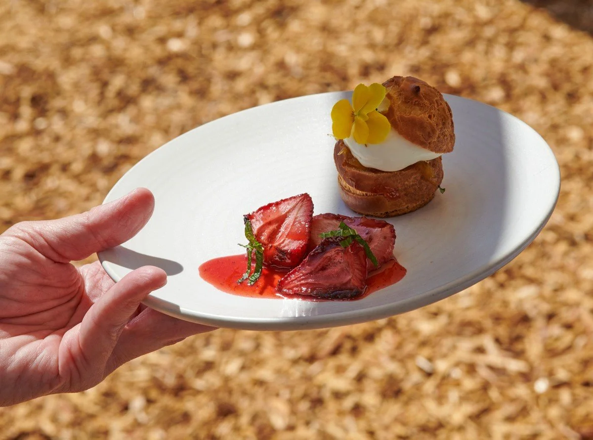 Strawberry dessert plate held over the garden path at Kendall-Jackson, shot for the Culinary Institute of America