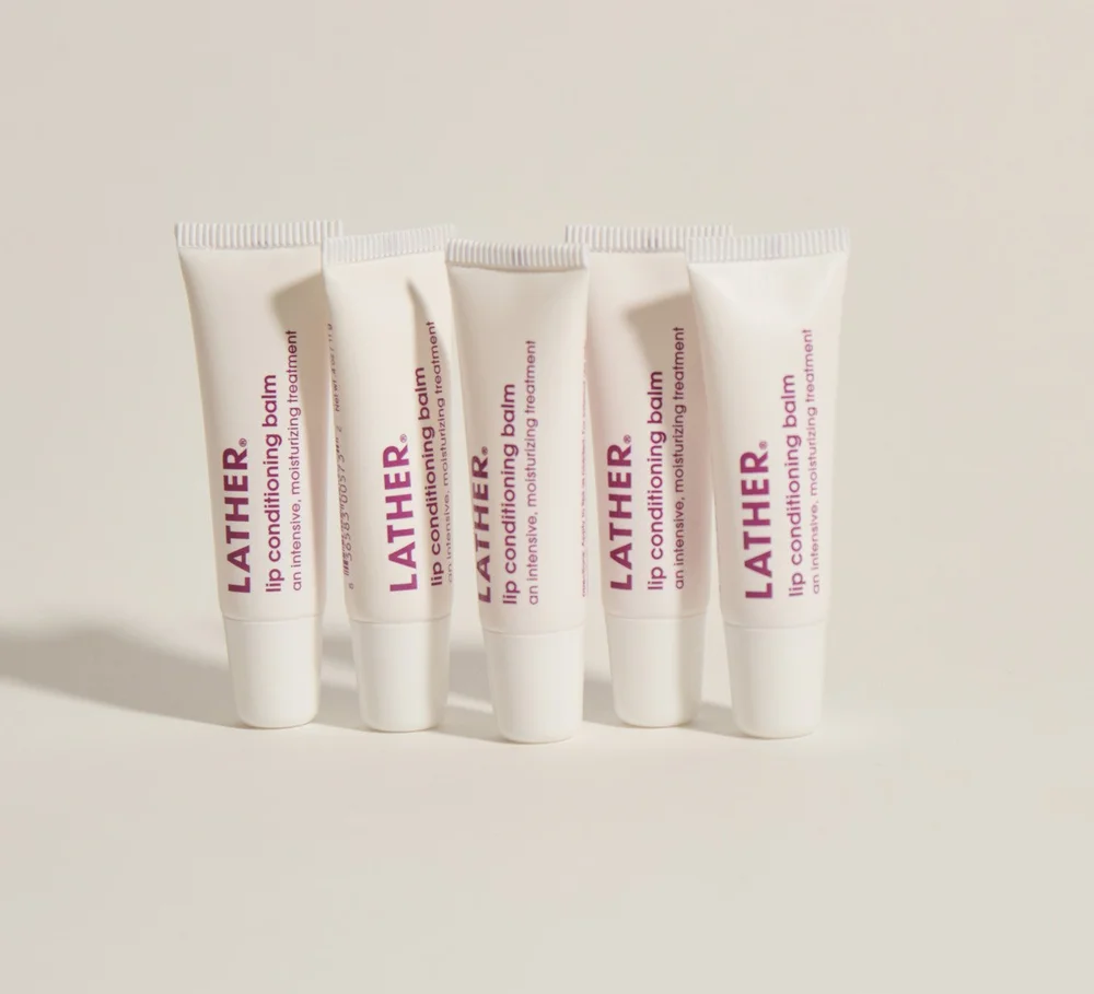 Row of Lather lip conditioner tubes, beauty product photography