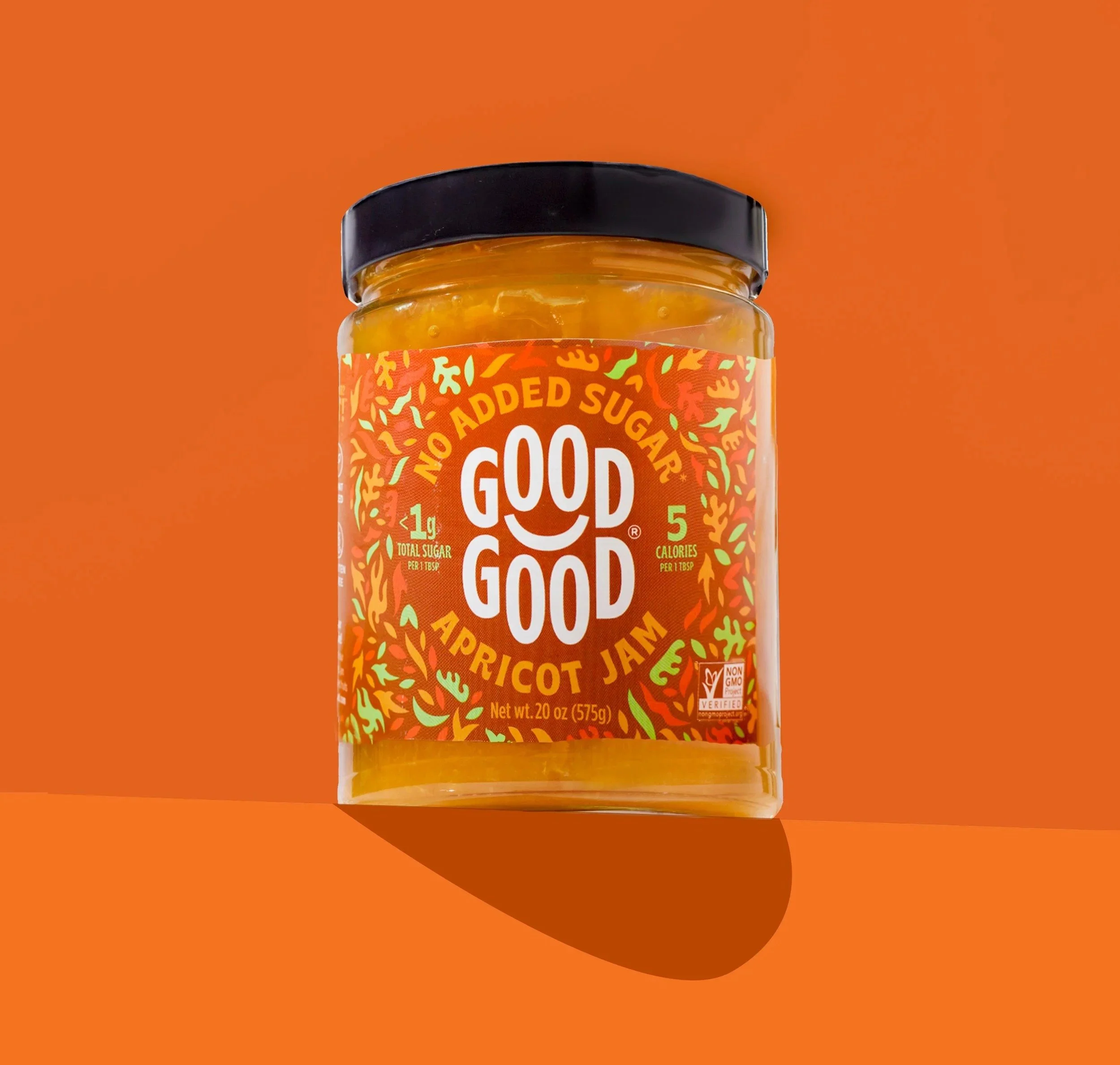 Good Good apricot jam jar on orange, CPG product photography