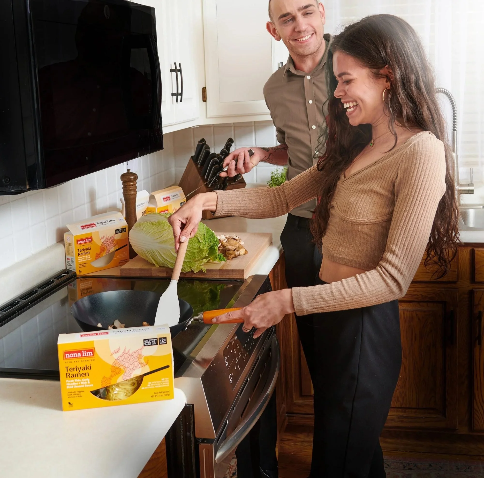 Couple cooking in a kitchen with a frozen food box, CPG lifestyle photography