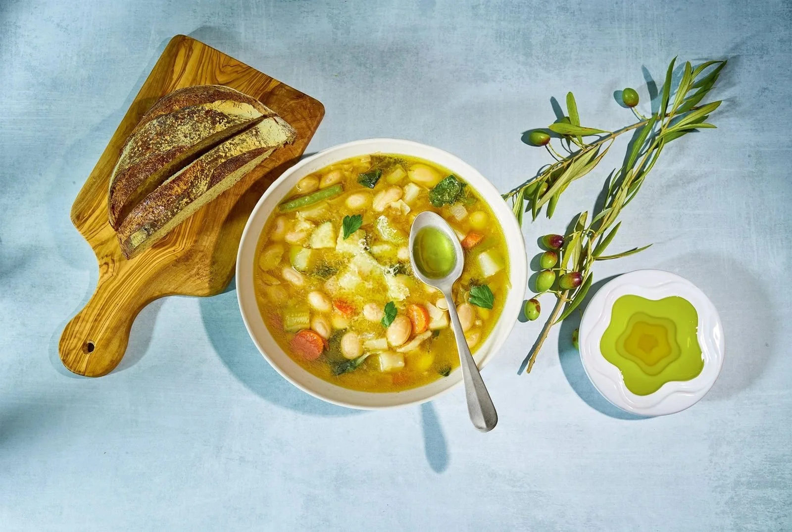 Bean soup finished with olive oil, editorial food photography