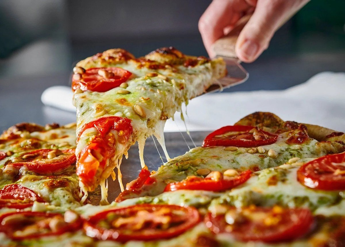 Pizza slice with a cheese pull
