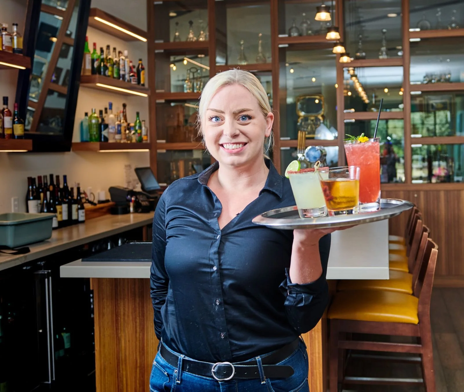 Server carrying cocktails at the CIA at Copia bar
