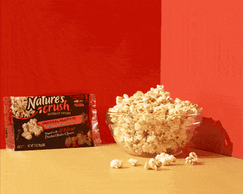 Nature's Crunch popcorn eating stop motion GIF on red, CPG snack video