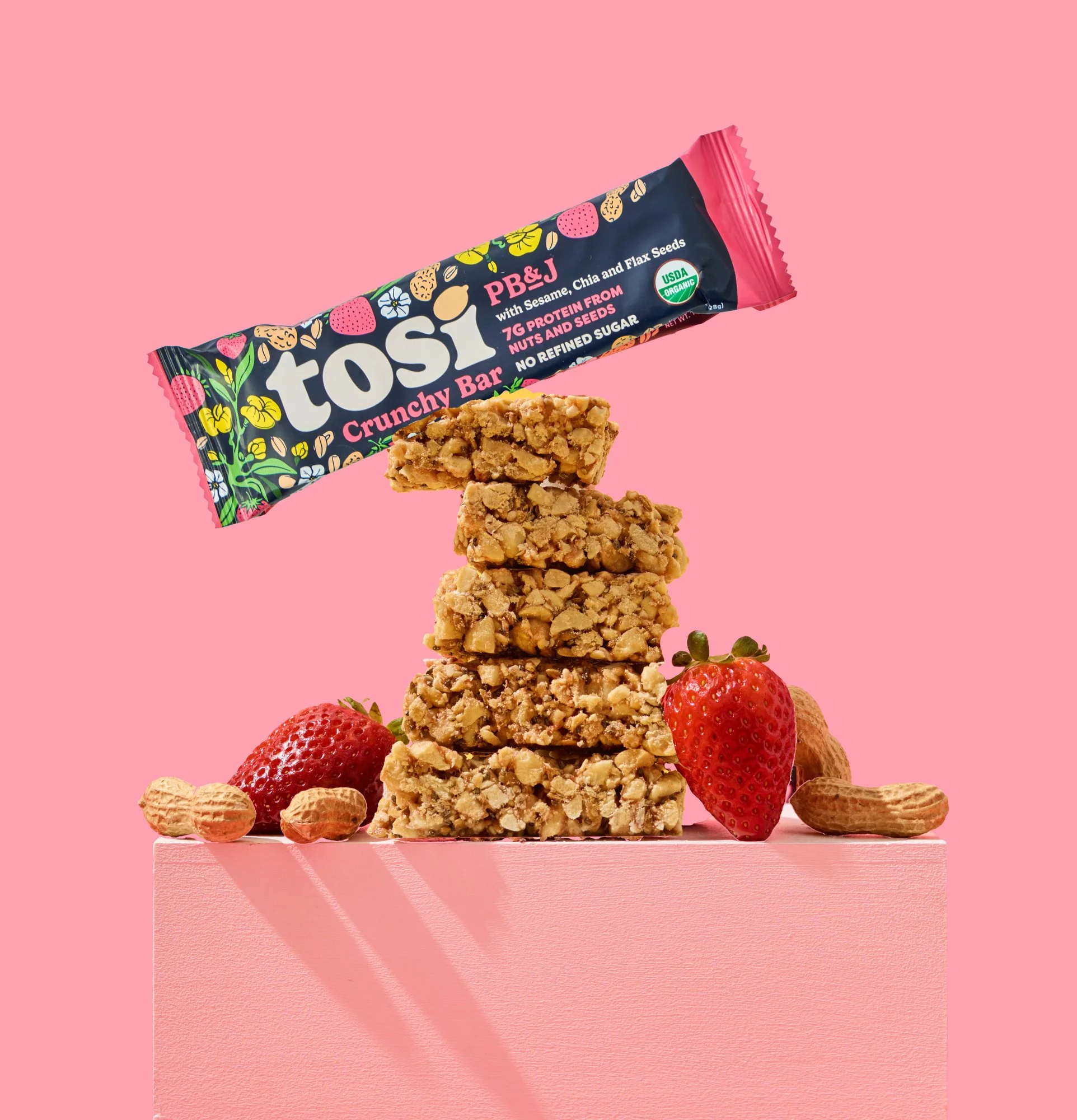 cpg snack bar with creative heart ingredient flow on branded color background