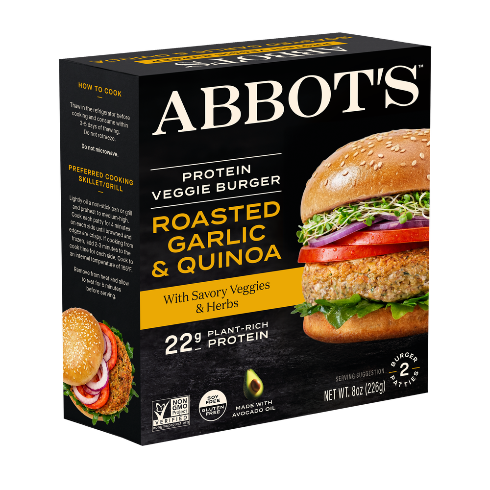 Package of ABBOT'S protein veggie burger with roasted garlic and quinoa, served with savory veggies and herbs, showing a burger with lettuce, tomato, onion, and sprouts.