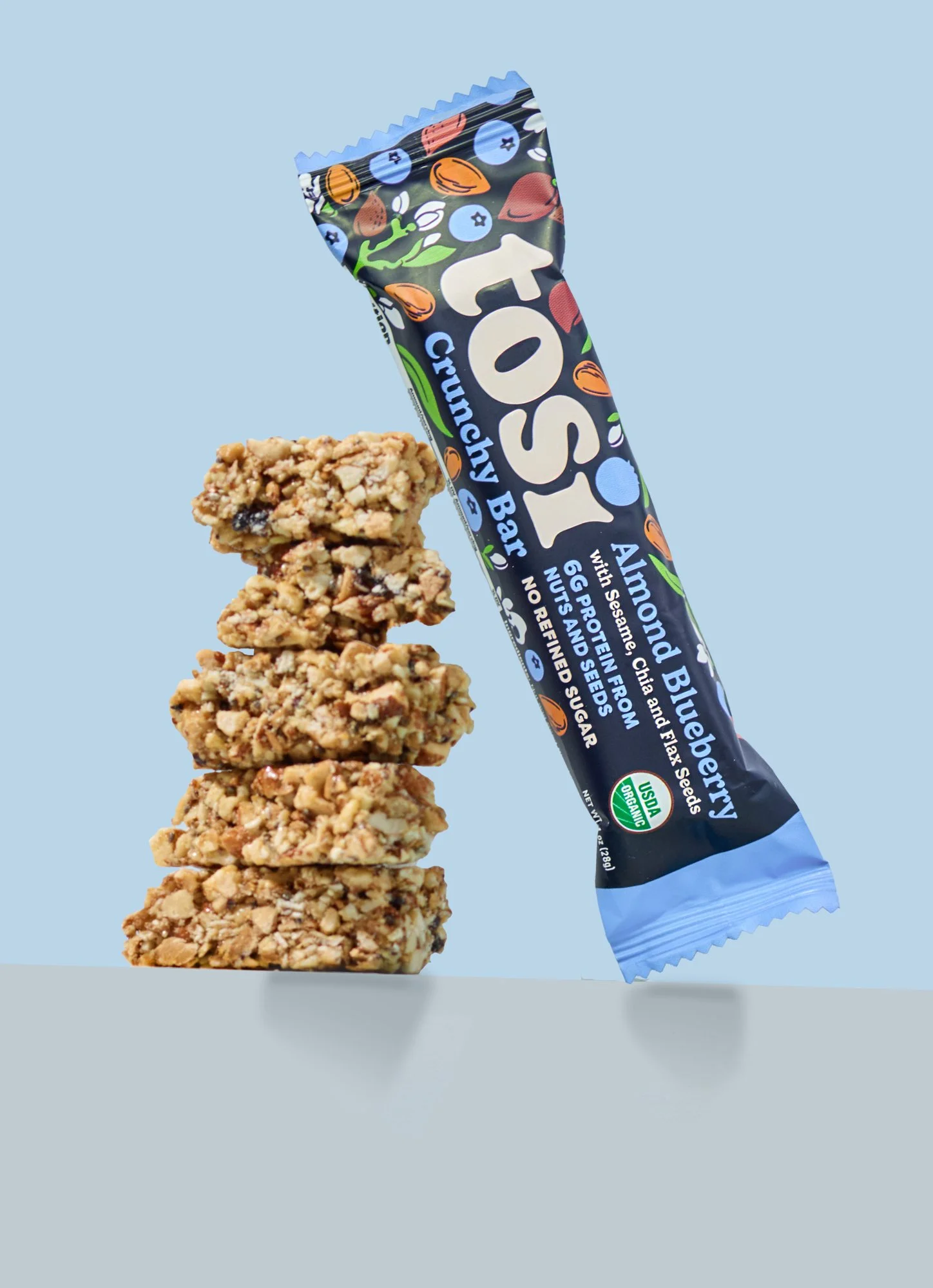 cpg snack bar with creative heart ingredient flow on branded color background