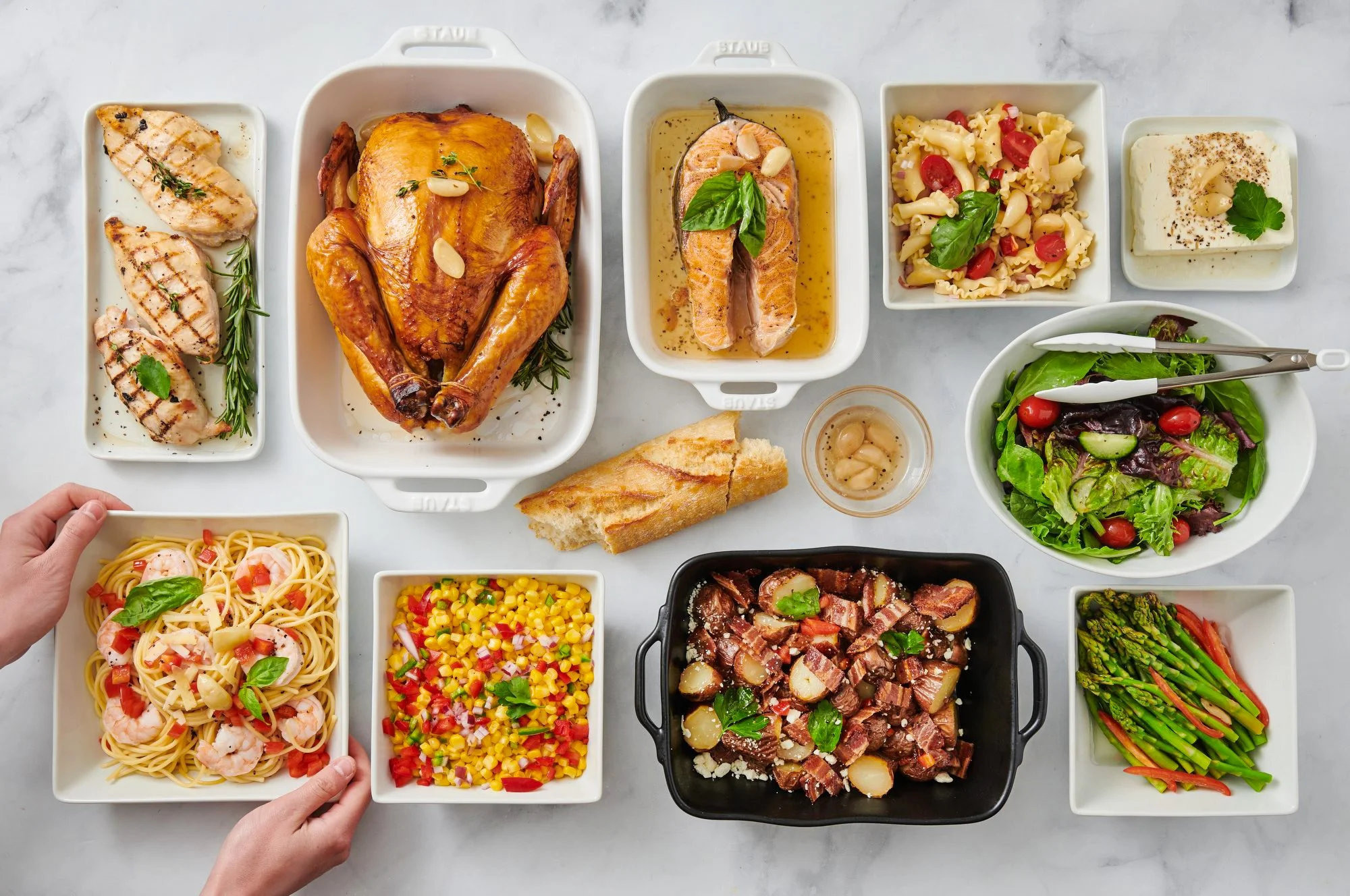 Food styling: catering meal prep spread with hands