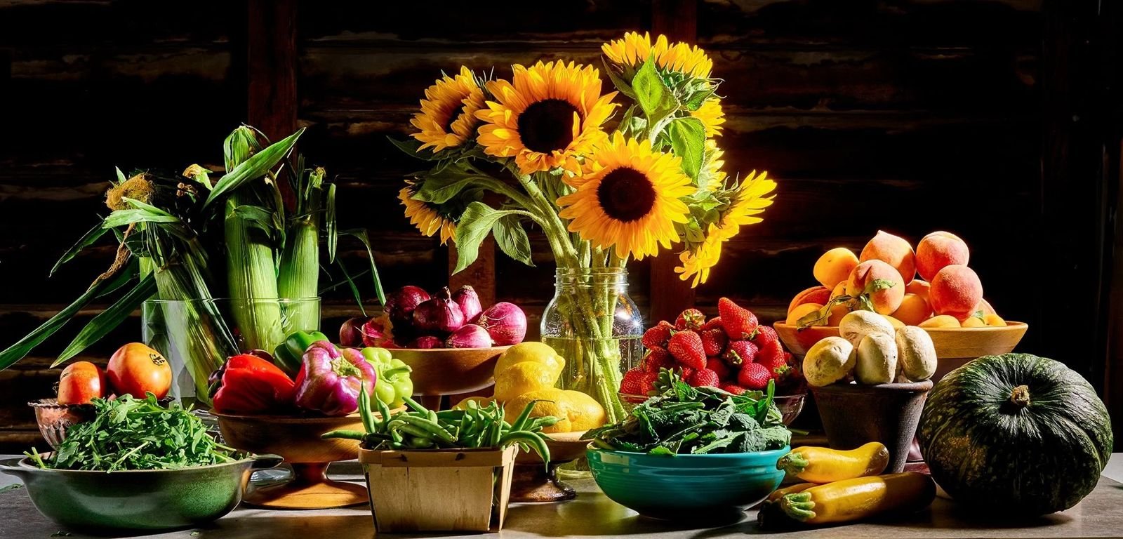 Farmers market still life with sunflowers and fresh produce