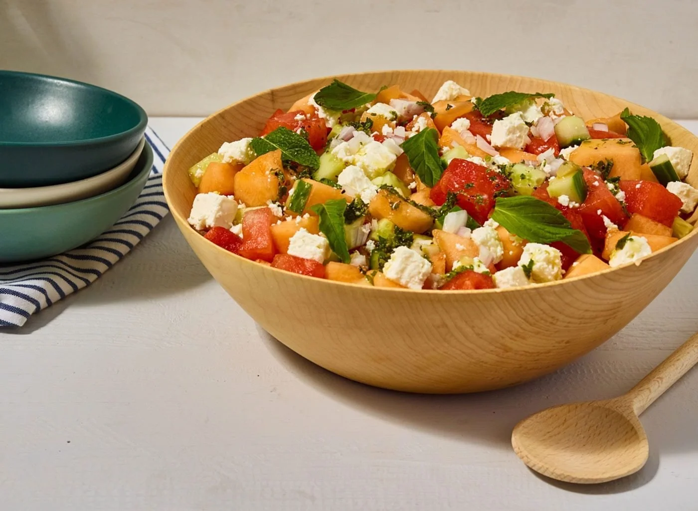 Food styling: sweet summer salad with feta and tomatoes